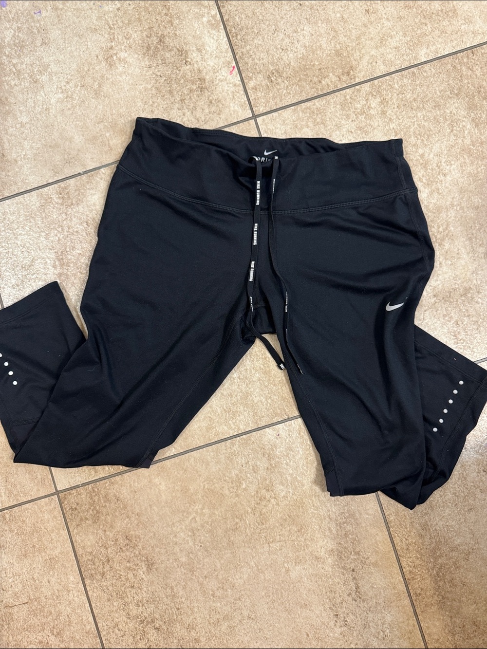Nike Black Capri Leggings with Reflective Swoosh and Dotted Accents
